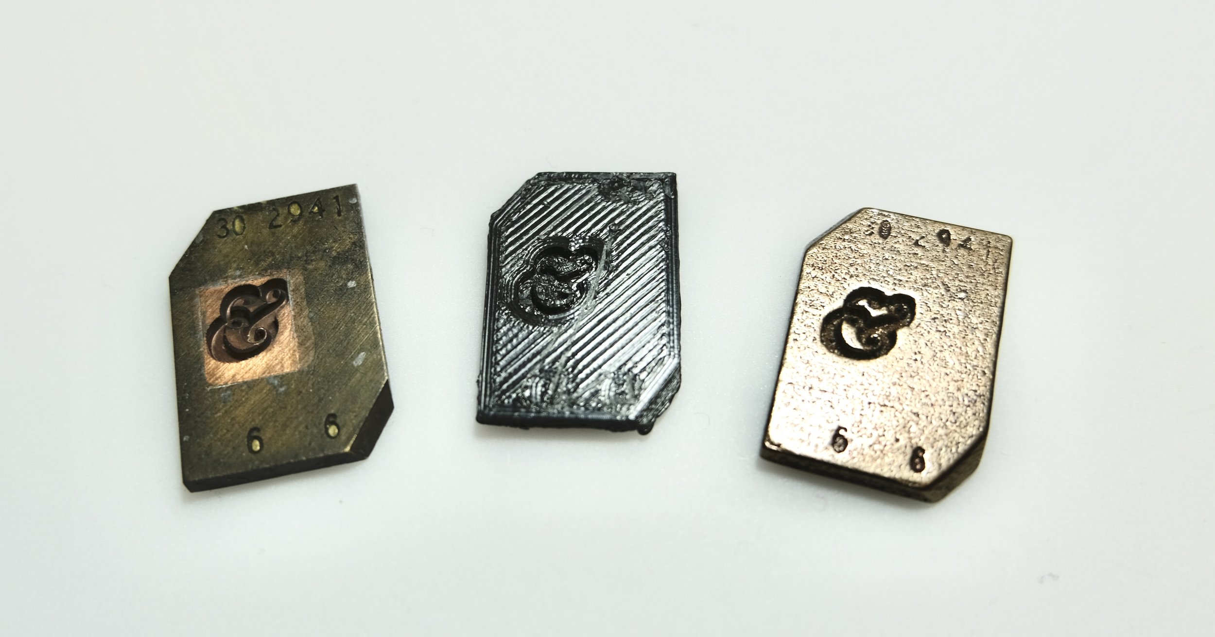  Left to right: Original Monotype matrix, low-res 3D PLA print, high-res metal 3D print 