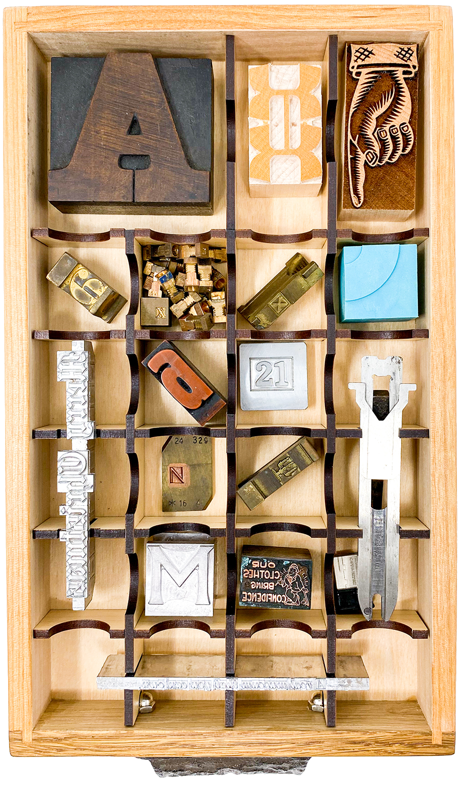  The bottom drawer of a Tiny Type Museum & Time Capsule, showing a typical selection of artifacts 